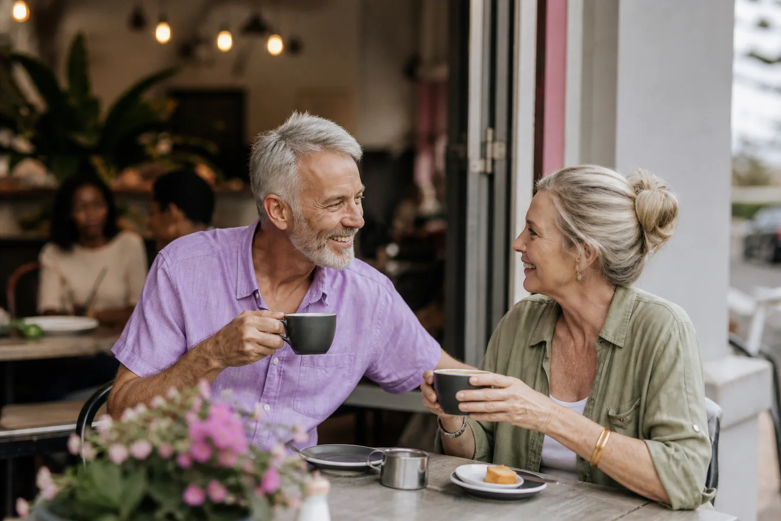 Mature couple talking over coffee at a relaxed London café